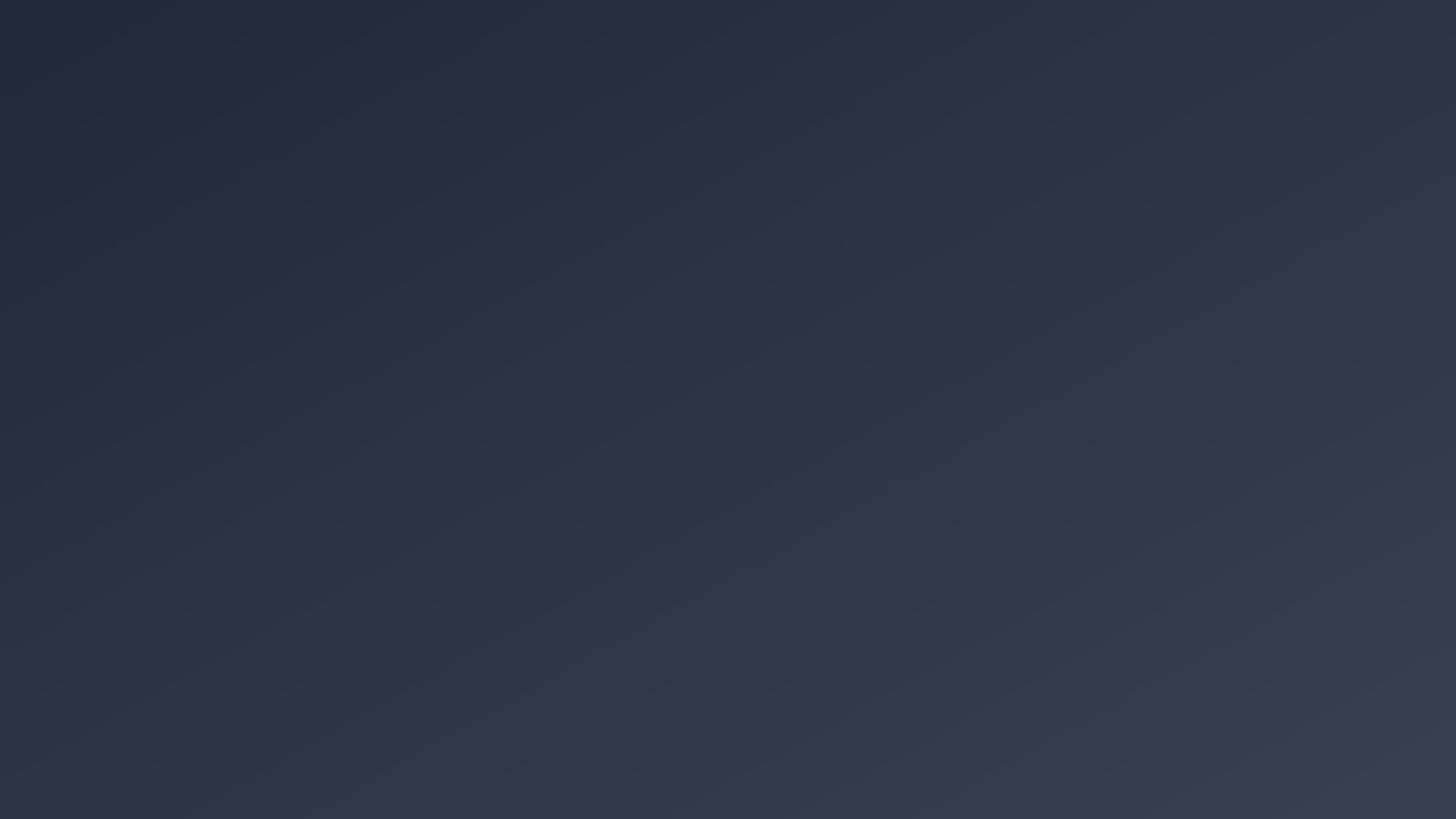 Solid dark blue-gray background with no visible objects or text
